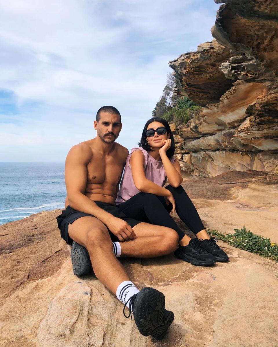 Martha and Michael  from MAFS sitting on a clifftop