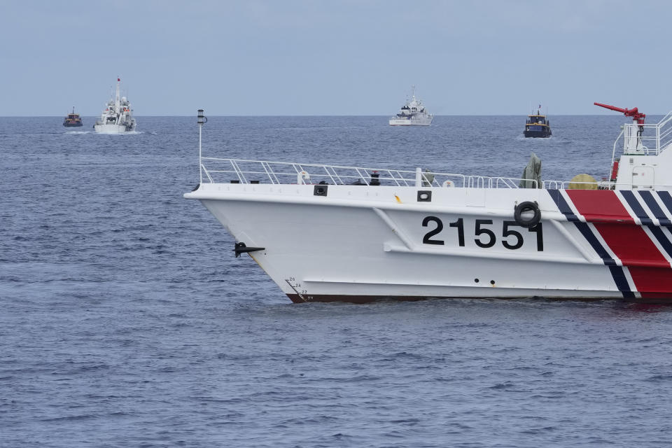 Philippine supply boats evade Chinese coast guard ship blockade as they head towards Second Thomas Shoal, locally known as Ayungin Shoal, at the disputed South China Sea on Tuesday, Aug. 22, 2023. As a U.S. Navy plane circled overhead, two Philippine navy-manned boats manage to breach through a Chinese coast guard blockade in a dangerous confrontation in the disputed South China Sea and succeeded in delivering food and other supplies to Filipino forces guarding a contested shoal on board BRP Sierra Madre. (AP Photo/Aaron Favila)