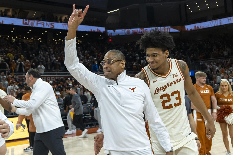 Texas interim head coach Rodney Terry and forward Dillon Mitchell (23) celebrate a win against Baylor during an NCAA college basketball game Monday, Jan. 30, 2023, in Austin, Texas. (AP Photo/Stephen Spillman)
