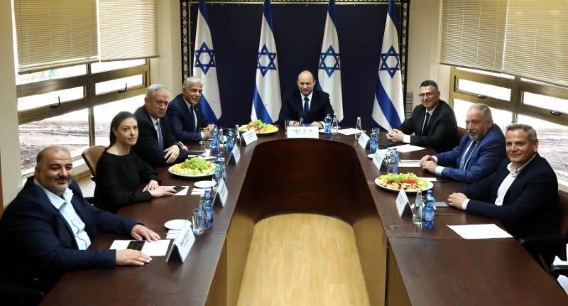 FILE PHOTO: Party leaders of the proposed new coalition government, pose for a picture at the Knesset, Israel's parliament, before the start of a special session to approve and swear-in the coalition government, in Jerusalem