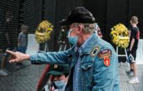 U.S. Army Vietnam veteran Brent Gulick touches a name of one of the fallen on the Vietnam Veterans Memorial on Memorial Day in Washington