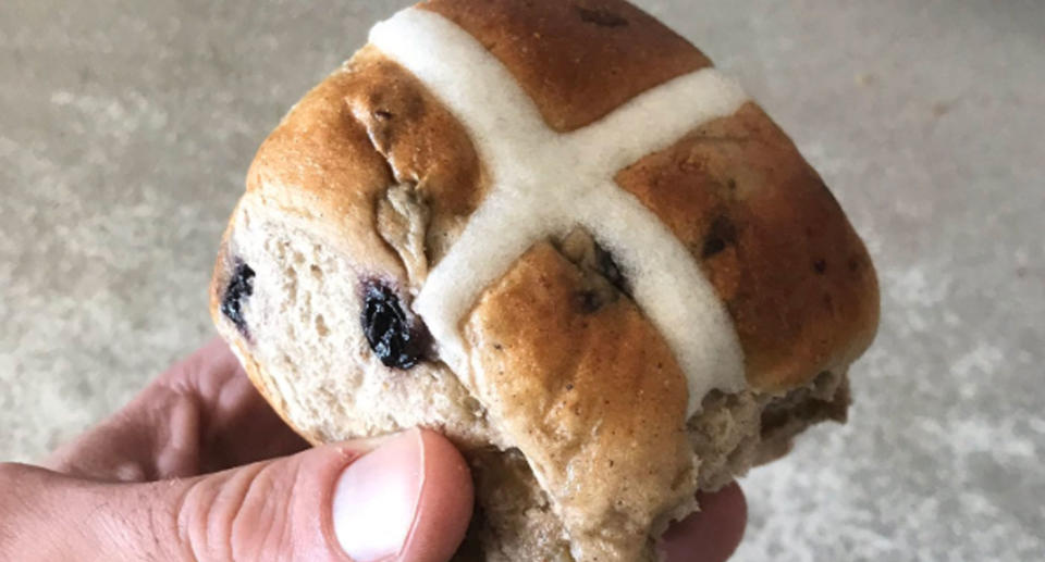 Coles hot cross bun pictured as supermarket decides to sell them all year after customer demand. 