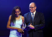 Almaz Ayana (L) of Ethiopia is congratulated by Prince Albert II of Monaco after receiving the female World Athlete of the Year Award 2016 in Monaco December 2, 2016. REUTERS/Eric Gaillard