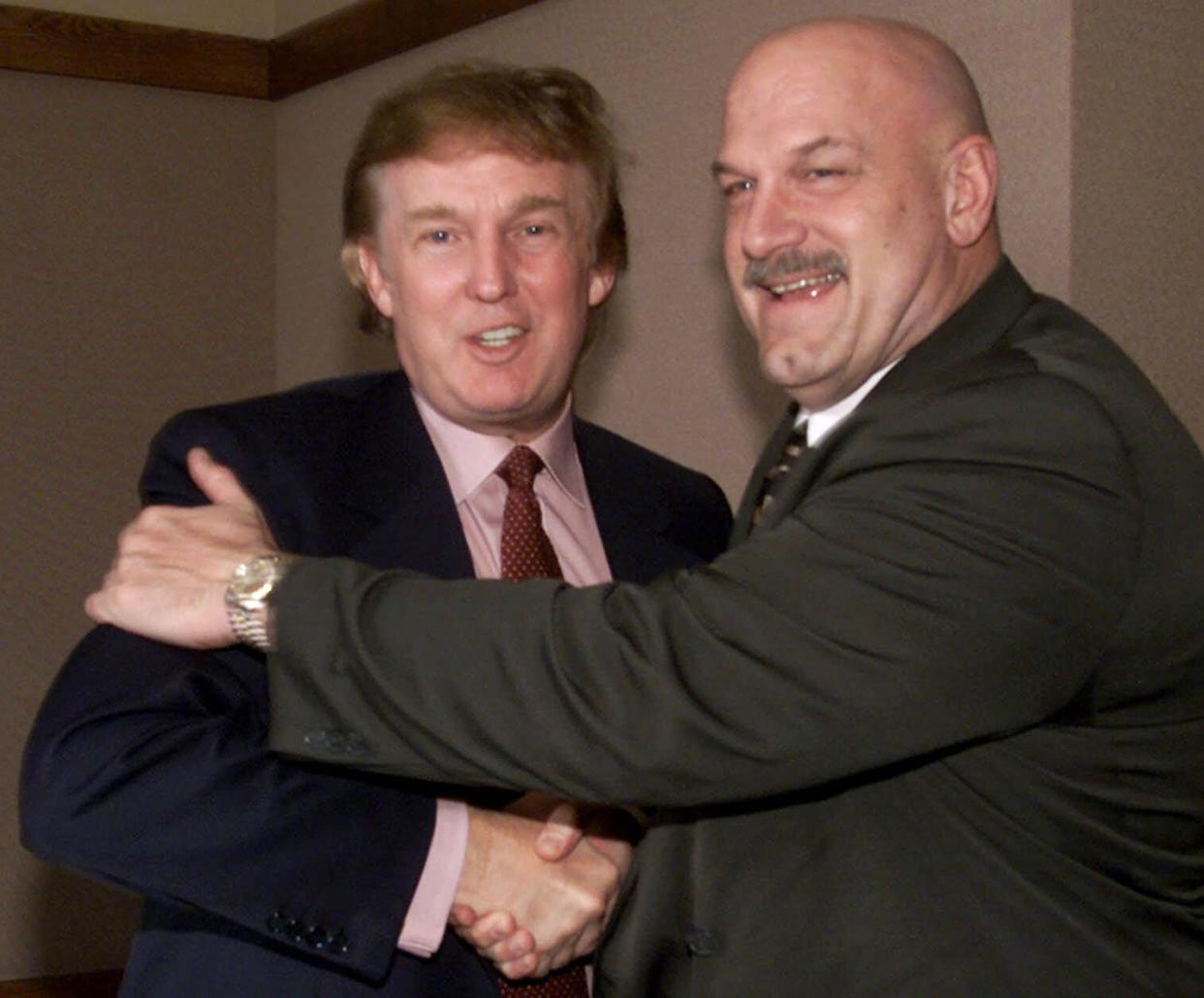 Donald Trump, left, greets Minnesota Gov. Jesse Ventura in Minneapolis on  Jan. 7, 2000.