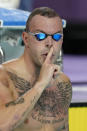 Kyle Chalmers of Australia reacts after winning the gold medal in the Men's 100 meters freestyle final during the swimming competition of the Commonwealth Games, at the Sandwell Aquatics Centre in Birmingham, England, Monday, Aug. 1, 2022. (AP Photo/Kirsty Wigglesworth)