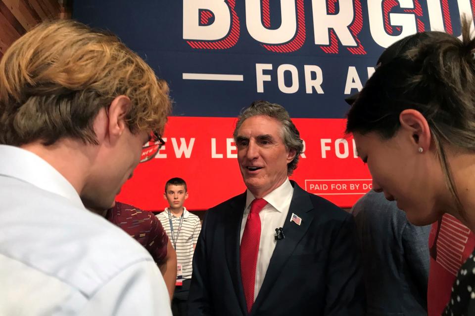 North Dakota Gov. Doug Burgum talks with supporters after he announced his bid for the Republican nomination for President, Wednesday, June 7, 2023, in Fargo, N.D.