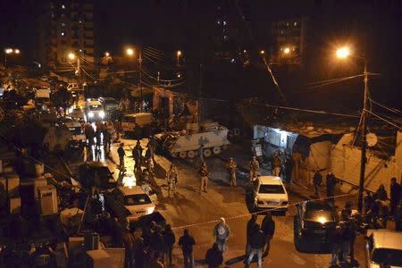 Lebanese Army soldiers man an area beside a cafe where a suicide bomb attack took place in Jabal Mohsen, Tripoli January 10, 2015. REUTERS/Stringer