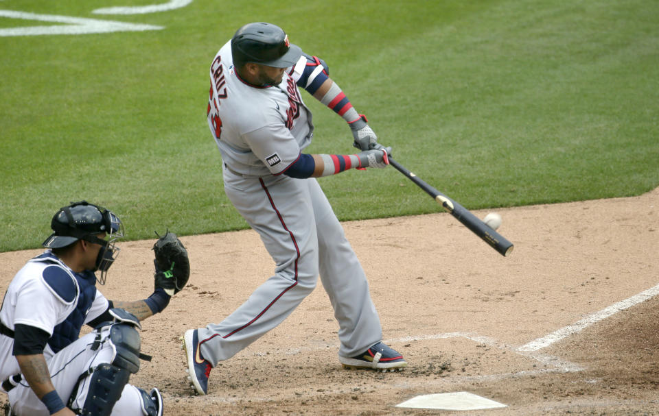 DETROIT, MI -  APRIL 5:  Nelson Cruz #23 of the Minnesota Twins hits a solo home run with catcher Wilson Ramos #40 of the Detroit Tigers behind the plate during the fifth inning at Comerica Park on April 5, 2021, in Detroit, Michigan. (Photo by Duane Burleson/Getty Images)