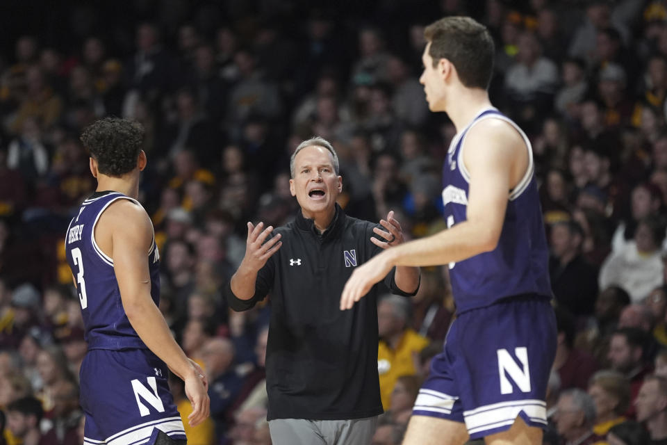 Northwestern head coach Chris Collins reacts toward guards Ty Berry, left, and guard Ryan Langborg during the second half of an NCAA college basketball game against Minnesota, Saturday, Feb. 3, 2024, in Minneapolis. (AP Photo/Abbie Parr)