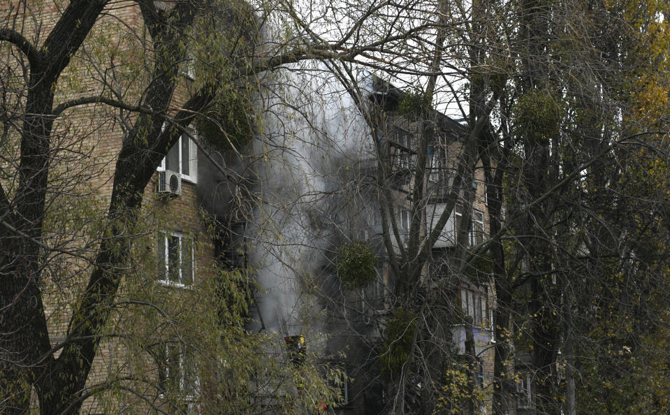 A damaged building seen at the scene of Russian shelling in Kyiv, Ukraine, Tuesday, Nov. 15, 2022. Strikes hit residential buildings in the heart of Ukraine's capital Tuesday, authorities said. Further south, officials announced probes of alleged Russian abuses in the newly retaken city of Kherson, including torture sites and enforced disappearances and detentions. (AP Photo/Andrew Kravchenko)
