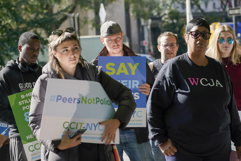 Leah Faria, right, with the Woman's Community Justice Association participates in a rally to call for peer-led, non-police response to mental health crisis calls, Thursday, Sept. 29, 2022, in New York. The Associated Press has found that 14 of the 20 most populous U.S. cities are experimenting with removing police from some nonviolent 911 calls and sending behavioral health clinicians. Initiatives in major cities including New York, Los Angeles, Columbus, Ohio, and Houston had combined annual budgets topping $123 million as of June 2023. (AP Photo/Mary Altaffer)