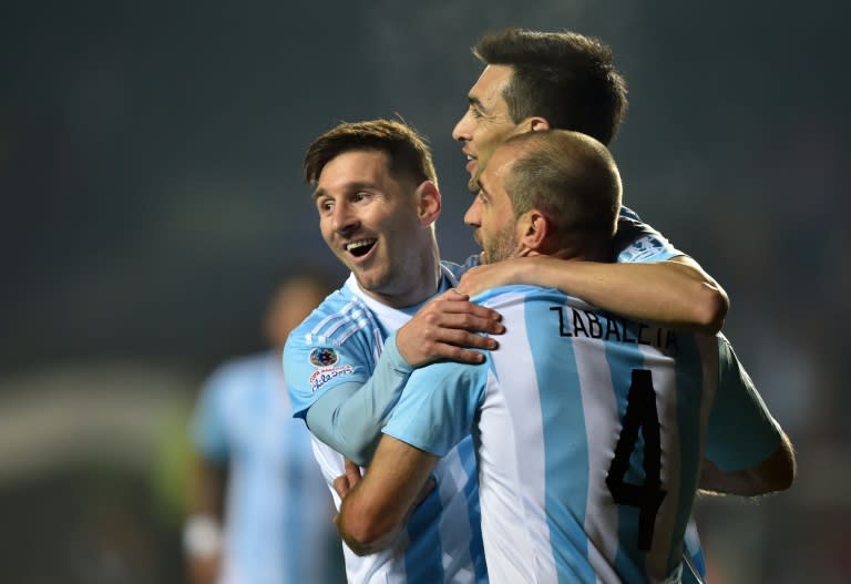 Argentina's Javier Pastore (C) celebrates with teammates Lionel Messi (L) and Pablo Zabaleta after scoring against Paraguay during their Copa America semi-final match in Concepcion, Chile, on June 30, 2015