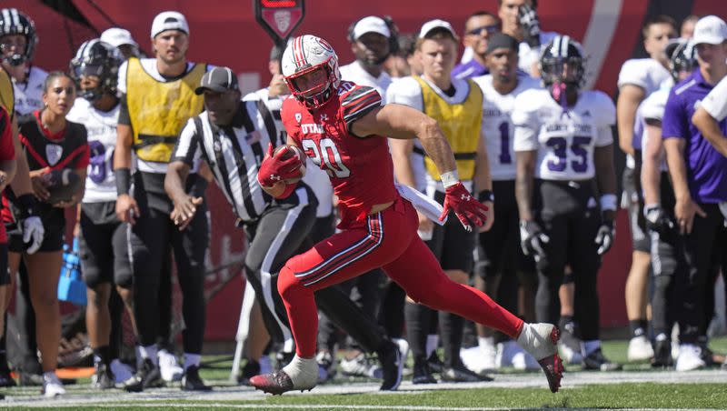 Utah linebacker Lander Barton returns an interception for a touchdown during game against Weber State, Saturday, Sept. 16, 2023, in Salt Lake City. 