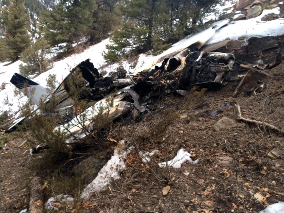 This photo released by the San Miguel Sheriff’s Office shows the wreckage of a private Beechcraft Bonanza single-engine plane that crashed near a Colorado ski town's airport, killing all three people aboard. Sheriff's spokeswoman Jennifer Dinsmore said deputies began the recovery effort west of Telluride, Colo., Monday Feb. 17, 2014. The airplane took off from Telluride Regional Airport on Sunday, Feb. 16 on its way to Cortez, a city in southwest Colorado about 75 miles away. (AP Photo/San Miguel Sheriff’s Office)