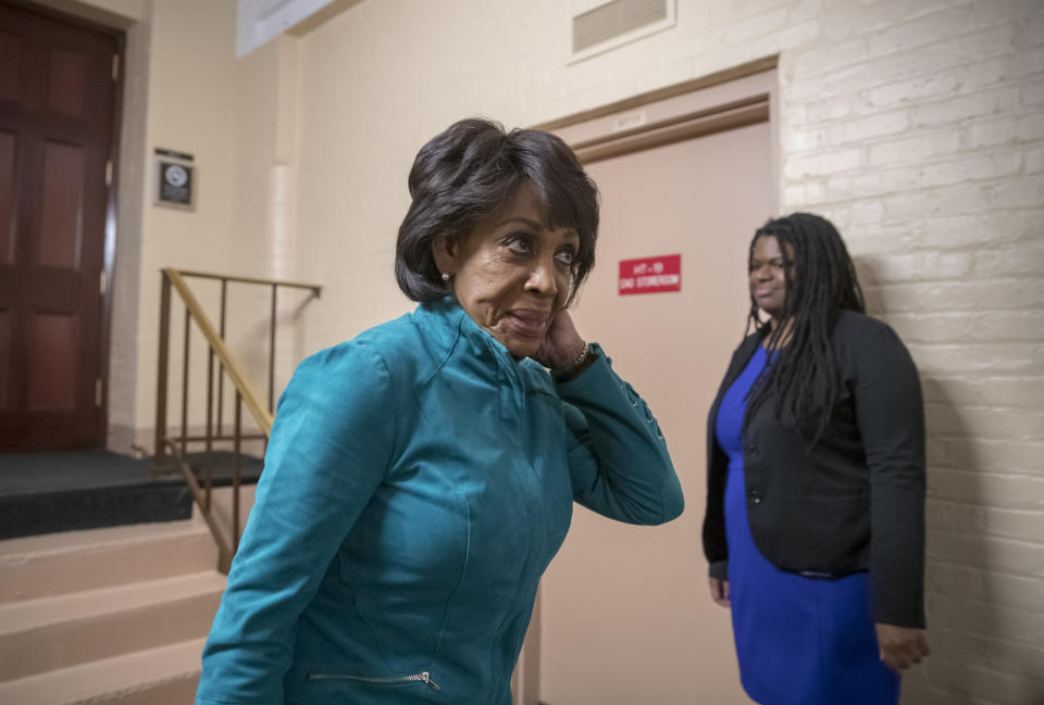 FILE - In this Nov. 15, 2018 file photo, Rep. Maxine Waters, D-Calif., ranking member of the Committee on Financial Services, walks through the basement of the Capitol as she leaves a Democratic Caucus meeting, in Washington. The committee is working with California Rep. Adam Schiff, the top Democrat on the House Intelligence Committee, who along with Waters has said he wants to investigate whether Russians used laundered money for transactions with the Trump Organization. (AP Photo/J. Scott Applewhite, File)