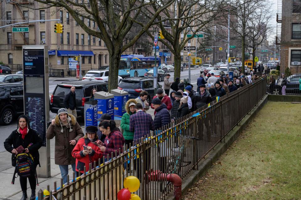 Ukrainian refugees wait in line to attend a job fair in the Brooklyn borough of New York on Feb. 1, 2023. / Credit: ANGELA WEISS/AFP via Getty Images