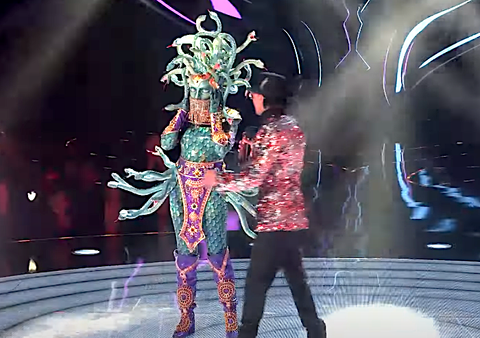 The Medusa is told not to remove her mask, just as 'The Masked Singer' host Nick Cannon was about to revela her idenity. (Photo: Fox)