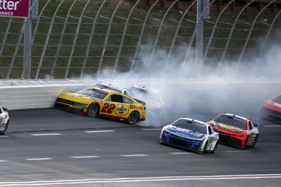 Joey Logano (22) crashes during the NASCAR auto race at Atlanta Motor Speedway Sunday, Feb. 25, 2024, in Hampton, Ga. (AP Photo/Greg McWilliams)