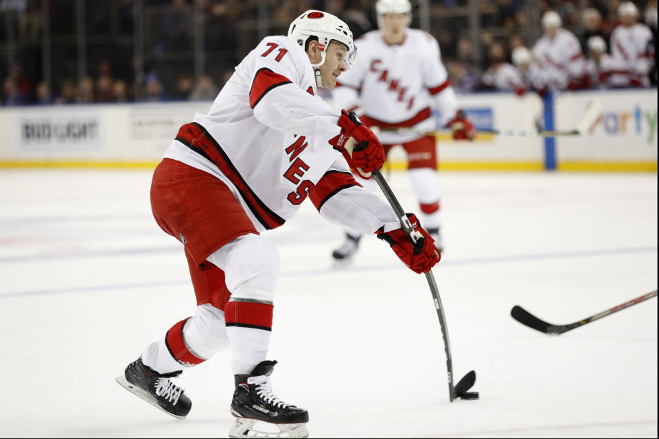Carolina Hurricanes center Lucas Wallmark (71) takes a shoots against the New York Rangers during the first period of an NHL hockey game Friday, Dec. 27, 2019, in New York. Wallmark had a goal in the period. (AP Photo/Kathy Willens)