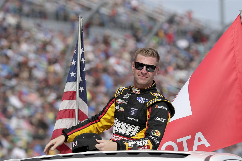 Clint Bowyer takes a parade lap in front of fans before the NASCAR Daytona 500 auto race at Daytona International Speedway, Sunday, Feb. 16, 2020, in Daytona Beach, Fla. (AP Photo/John Raoux)