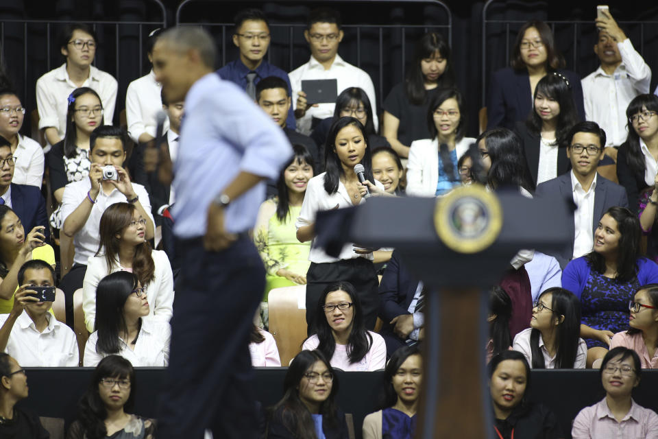 FILE - Then-U.S. President Barack Obama listens as Vietnamese rapper Suboi, speaks at a town-hall style event for the Young Southeast Asian Leaders Initiative at the GEM Center in Ho Chi Minh City, Vietnam on May 25, 2016. Obama answered questions about human rights and free expression across the continent. The question from Suboi, the female rapper known as Vietnam’s “Queen of Hip-Hop” said she struggled against the Vietnamese stereotype that rap music isn’t a proper expression for Asian women. (AP Photo/Na Son Nguyen, file)