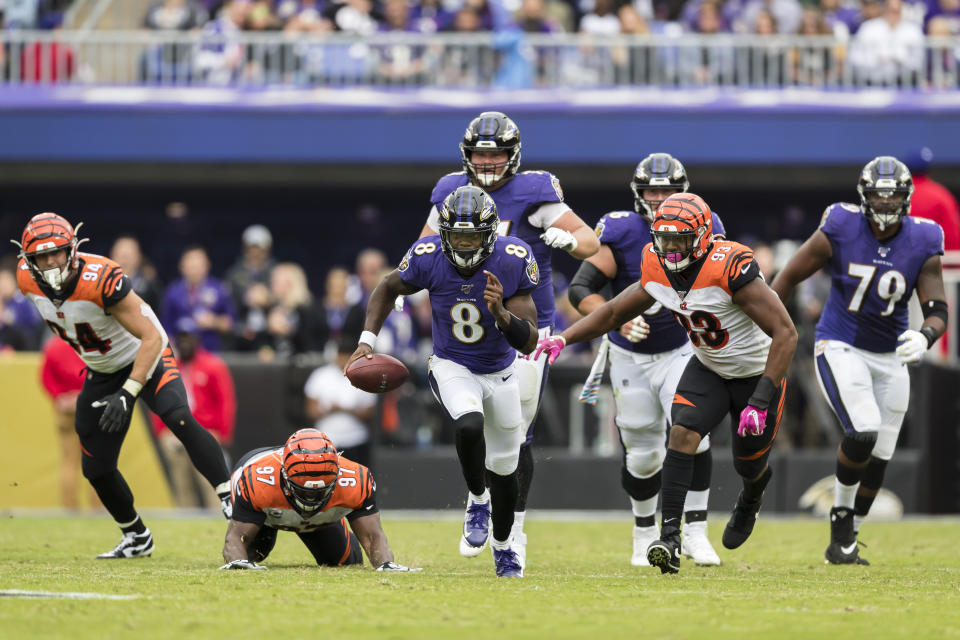 BALTIMORE, MD - OCTOBER 13: Lamar Jackson #8 of the Baltimore Ravens scrambles against the Cincinnati Bengals during the first half at M&T Bank Stadium on October 13, 2019 in Baltimore, Maryland. (Photo by Scott Taetsch/Getty Images)