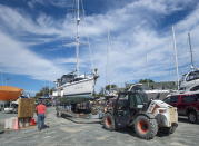 A sailboat is moved into the yard after being pulled from the water at the Dartmouth Yacht Club in Dartmouth, N.S., on Monday, Sept. 21, 2020. Hurricane Teddy is expected to impact the Atlantic region starting mid-day Tuesday as a post-tropical storm, bringing rain, wind and high waves. (Andrew Vaughan/The Canadian Press via AP)