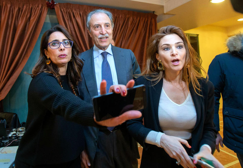 Center-right coalition candidate for governor of the Basilicata region Vito Bardi, center, arrives to meet the media in Potenza, southern Italy, Monday, March 25, 2019, a day after people in Basilicata voted in regional elections. The center-right led by Matteo Salvini’s League wrested control of the small southern region of Basilicata from the center-left Democratic Party that ran the regional government for a quarter of a century. Salvini on Monday touted the victory, saying that the League had tripled the number of votes in the region since last year’s national election, taking a swipe at the weakened center-left and looking ahead to elections for European parliament in May with ‘’greetings to the left, now to change Europe.’’ (Tony Vece/ANSA via AP)