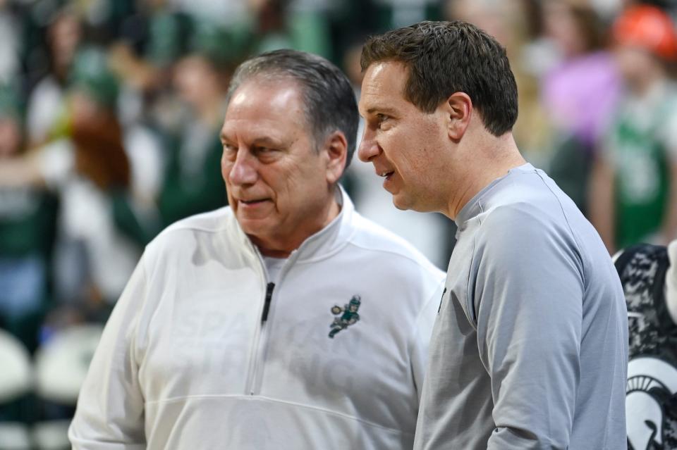 Former Michigan State player Mat Ishbia, right, talks with head coach Tom Izzo before the game against Maryland on Saturday, Feb. 3, 2024, at the Breslin Center in East Lansing.