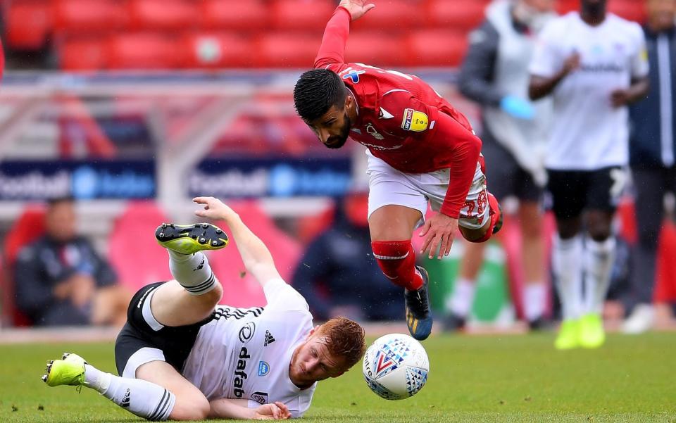 Harrison Reed of Fulham clashes with Tiago Silva of Nottingham Forest during the Sky Bet Championship match between Nottingham Forest and Fulham at City Ground on July 07, 2020 in Nottingham - GETTY IMAGES