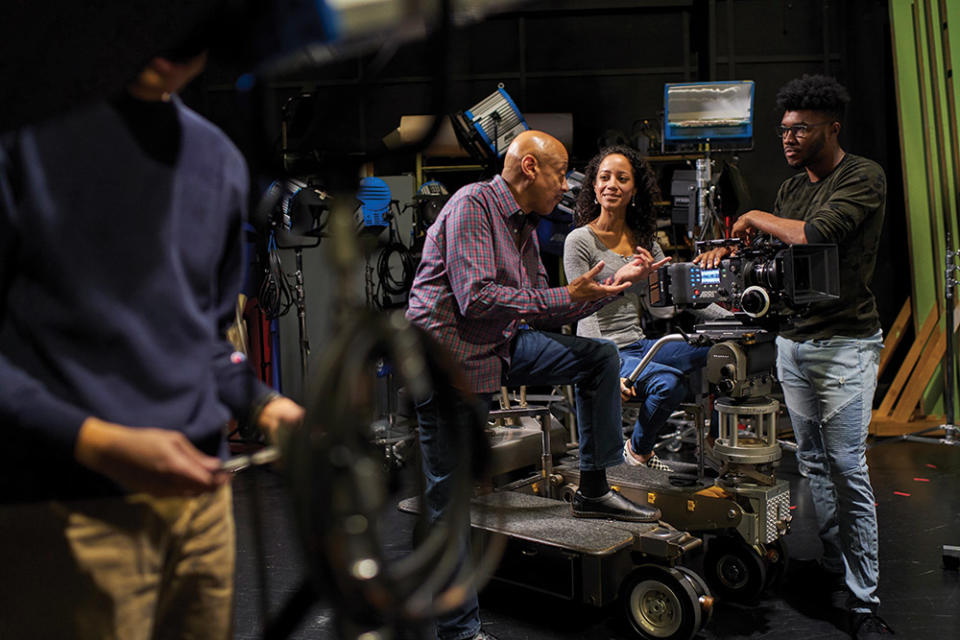 Students and instructor confer on the set at Cal State University, Northridge.