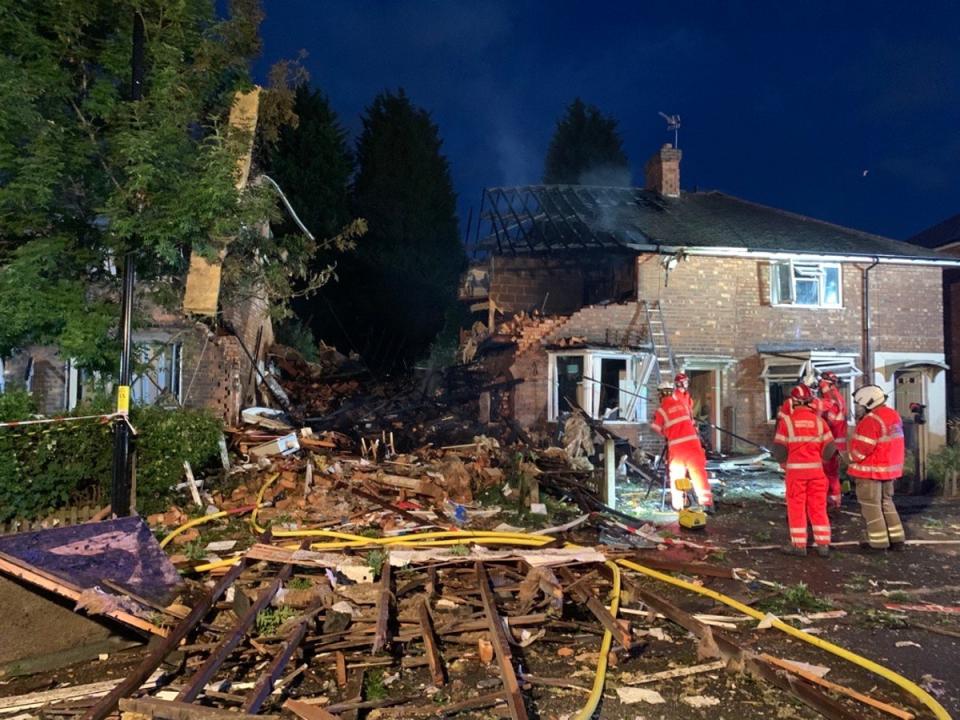 Explosion destroyed one house and significantly damaged several others as well as nearby cars (West Midlands Fire Service)