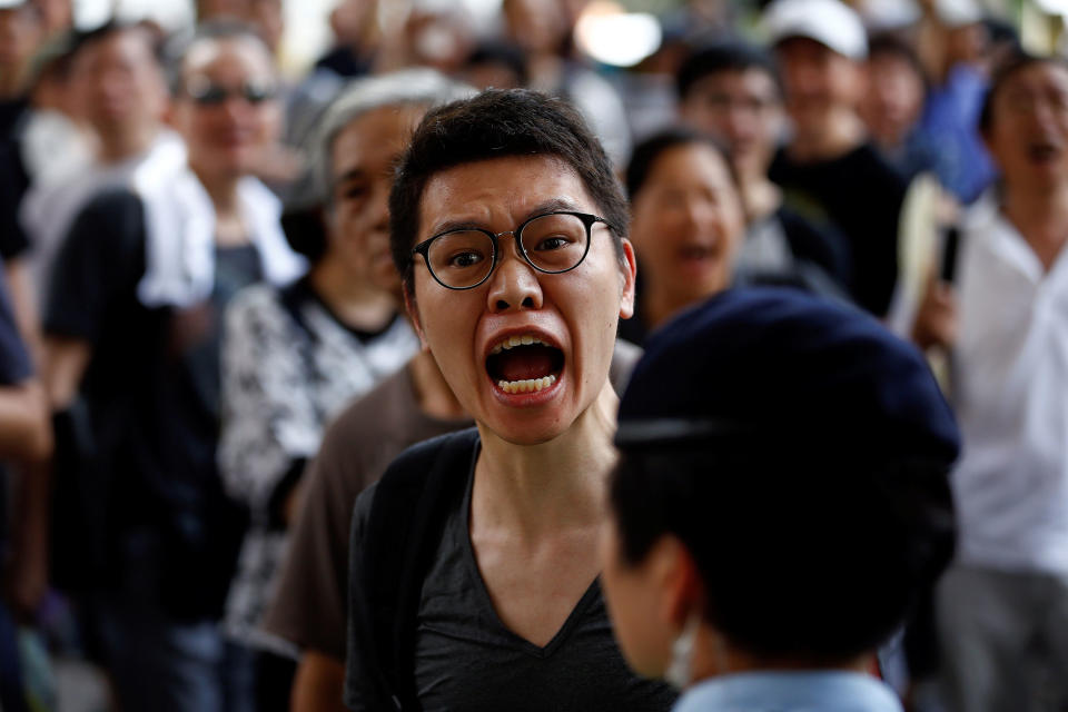 A man yells at pro-China supporters