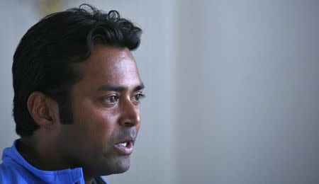 Tennis player Leander Paes speaks during an interview with Reuters at the Delhi Lawn Tennis Association (DLTA) stadium in New Delhi February 5, 2012. REUTERS/Parivartan Sharma/Files