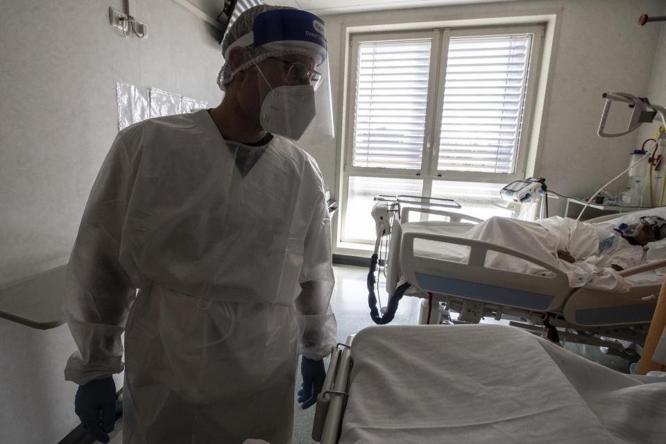 Dr. Gabriele Zanolini director of the main covid ward at Mellino Mellini hospital tends to a patient in the emergency COVID-19 in Chiari, northern Italy, Monday, March 8, 2021. The 160-bed hospital in the Po River Valley town of Chiari has no more beds for patients stricken with the highly contagious variant of COVID-19 first identified in Britain, and which now has put hospitals in Italy’s northern Brescia province on high alert. (AP Photo/Luca Bruno)