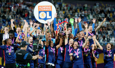 FILE PHOTO: Soccer Football - Women's Champions League Final - Olympique Lyonnais vs VfL Wolfsburg - Valeriy Lobanovskyi Stadium, Kiev, Ukraine - May 24, 2018 Lyon celebrate with the trophy after winning the Champions League Final REUTERS/Gleb Garanich/File Photo