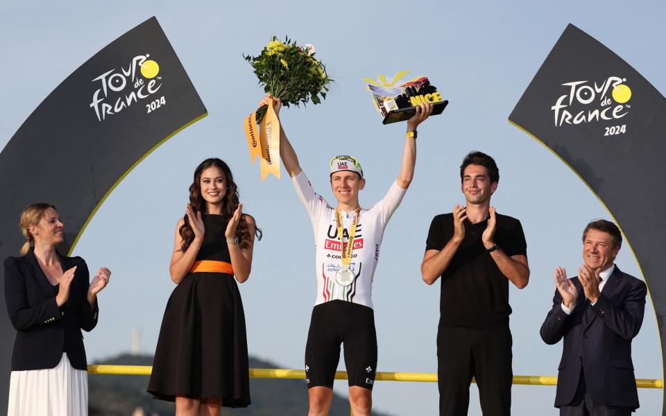 Tadej Pogacar celebrates winning the final stage of the 2024 Tour de France