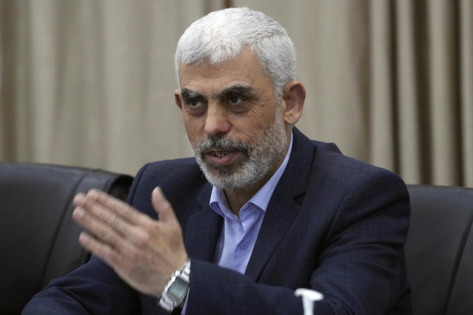 Yehia Sinwar, head of Hamas in Gaza, greets his supporters during a meeting with leaders of Palestinian factions at his office in Gaza City, Wednesday, April 13, 2022. The chief prosecutor of the International Criminal Court said Monday he is seeking arrest warrants for Israeli and Hamas leaders, including Israeli Prime Minister Benjamin Netanyahu, in connection with their actions during the seven-month war between Israel and Hamas. Yehia Sinwar is one of the three Hamas leaders believed to be responsible for war crimes and crimes against humanity in the Gaza Strip and Israel. (AP Photo/Adel Hana)