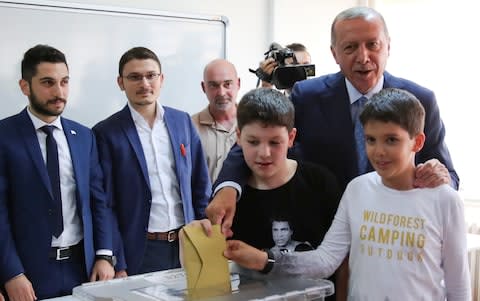 President Recep Tayyip Erdogan votes with his grandchildren in Istanbul - Credit: REUTERS/Umit Bektas