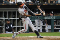 Baltimore Orioles' Richie Martin hits an RBI single during the second inning of the team's baseball game against the Chicago White Sox in Chicago, Friday, June 24, 2022. (AP Photo/Nam Y. Huh)