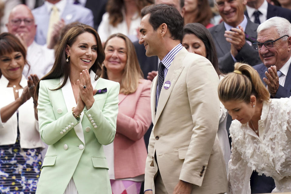 Britain's Kate, Princess of Wales, left, shares a word with tennis champion Roger Federer in the royal box, on day two of the Wimbledon tennis championships in London, Tuesday, July 4, 2023. (Adam Davy/PA via AP)