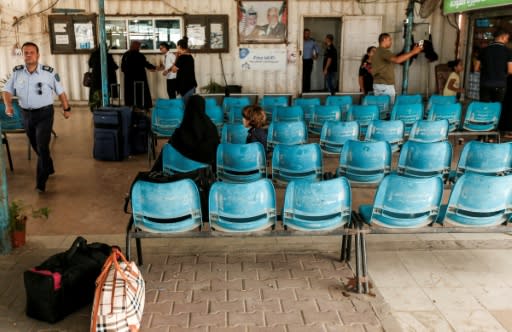 Palestinians wait at the Erez crossing with Israel near Beit Hanun in the northern Gaza Strip on August 27, 2018
