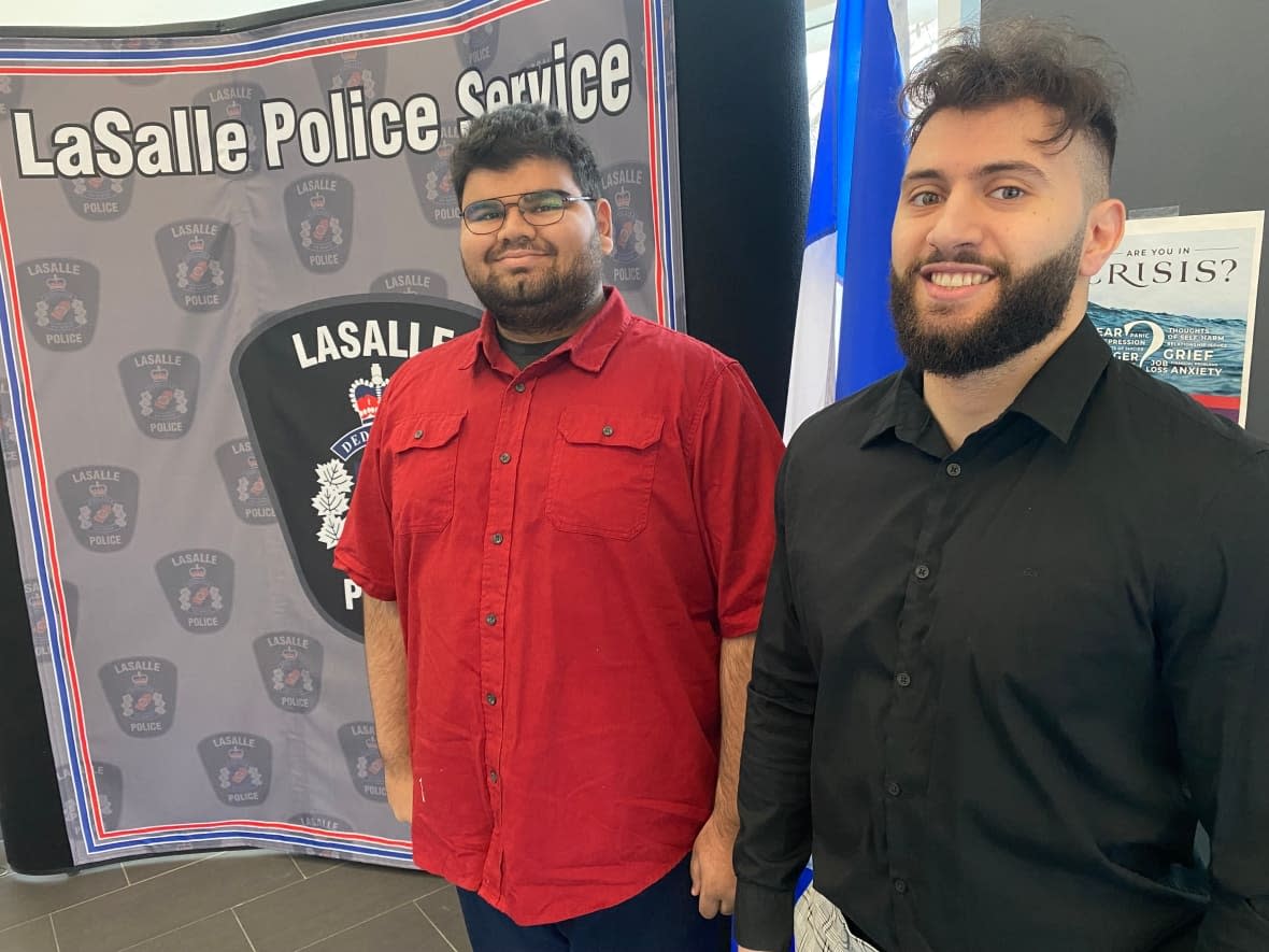 University of Windsor students Dan Aheer. left, and Sajed Farhat, right, spent a day at the LaSalle Police Service to explore law enforcement as a career path. (Jason Viau/CBC - image credit)