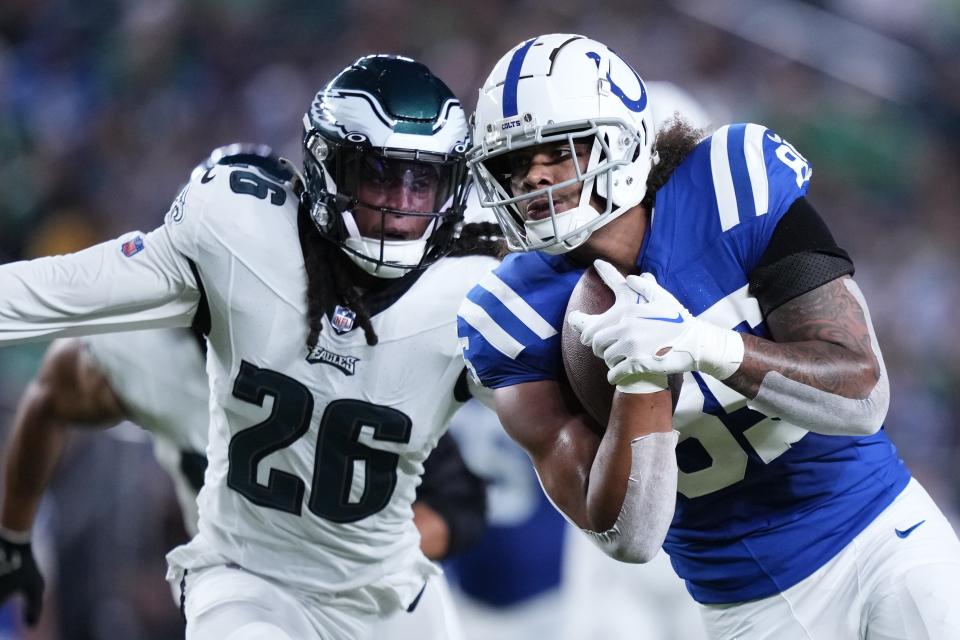 Indianapolis Colts tight end Andrew Ogletree (85) runs with the ball under pressure from Philadelphia Eagles safety Terrell Edmunds (26) during the first half of an NFL preseason football game Thursday, Aug. 24, 2023, in Philadelphia. (AP Photo/Matt Slocum)