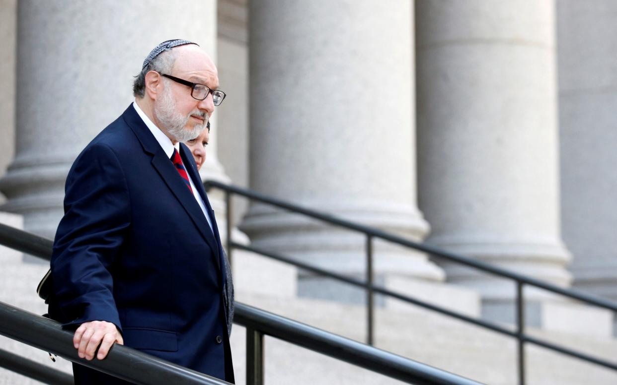 Jonathan Pollard, a former U.S. Navy intelligence officer convicted of spying for Israel, exits following a hearing at the Manhattan Federal Courthouse in New York - Reuters