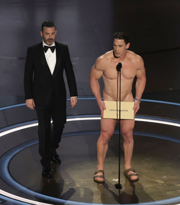 HOLLYWOOD, CALIFORNIA – MARCH 10: (L-R) Jimmy Kimmel and John Cena speak onstage during the 96th Annual Academy Awards at Dolby Theatre on March 10, 2024 in Hollywood, California. (Photo by Kevin Winter/Getty Images)