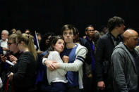 French citizens and Emmanuel Macron supporters Victor Dutreil and Louise Courchinoux react as they watch the televised French presidential elections at a viewing event held by the Universite de Montreal in Montreal, Quebec, Canada, April 23, 2017. REUTERS/Dario Ayala