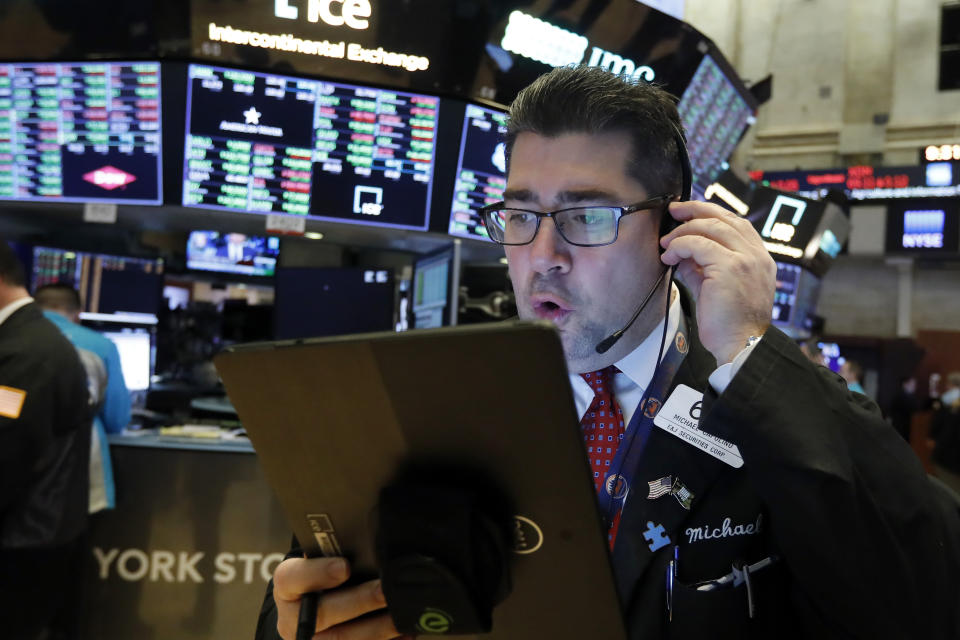 Trader Michael Capolino works on the floor of the New York Stock Exchange, Thursday, Jan. 9, 2020. Stocks are opening broadly higher on Wall Street as traders welcome news that China's top trade official will head to Washington next week to sign a preliminary trade deal with the U.S. (AP Photo/Richard Drew)