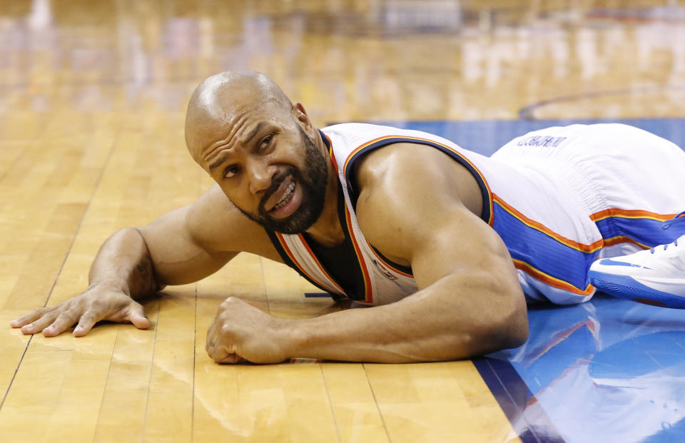 Oklahoma City Thunder guard Derek Fisher (6) lies on the court after a foul in the fourth quarter of Game 2 of the Western Conference semifinal NBA basketball playoff series against the Los Angeles Clippers in Oklahoma City, Wednesday, May 7, 2014. Oklahoma City won 112-101. (AP Photo/Sue Ogrocki)