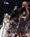 Miami Heat forward LeBron James (6) shoots against Brooklyn Nets forward Paul Pierce in the first period during Game 3 of an Eastern Conference semifinal NBA playoff basketball game on Saturday, May 10, 2014, in New York. (AP Photo/Julie Jacobson)